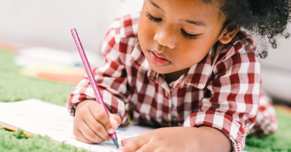 young child writing